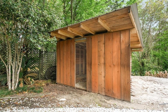 view of poultry coop featuring fence