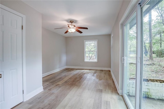 21216 Gardenia St, Covington, LA 70435 - empty room featuring ceiling fan and light wood finished floors