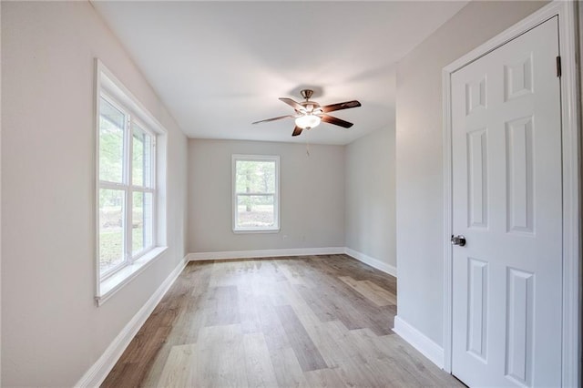 21216 Gardenia St, Covington, LA 70435 - empty room with light wood-style floors and ceiling fan