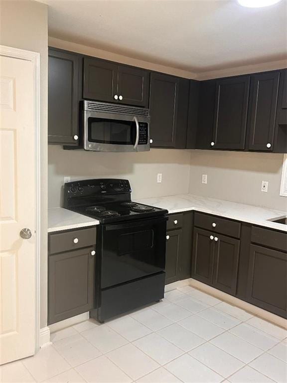 21216 Gardenia St, Covington, LA 70435 - kitchen featuring stainless steel microwave and black / electric stove