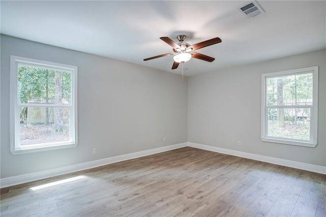 21216 Gardenia St, Covington, LA 70435 - unfurnished room featuring healthy amount of natural light, wood finished floors, and ceiling fan