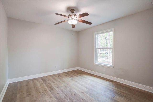 21216 Gardenia St, Covington, LA 70435 - empty room with wood finished floors and a ceiling fan