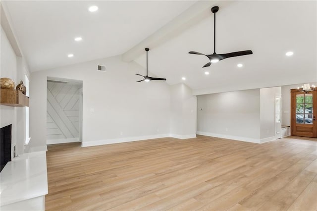unfurnished living room with light wood-style floors, a fireplace with raised hearth, vaulted ceiling with beams, visible vents, and ceiling fan with notable chandelier
