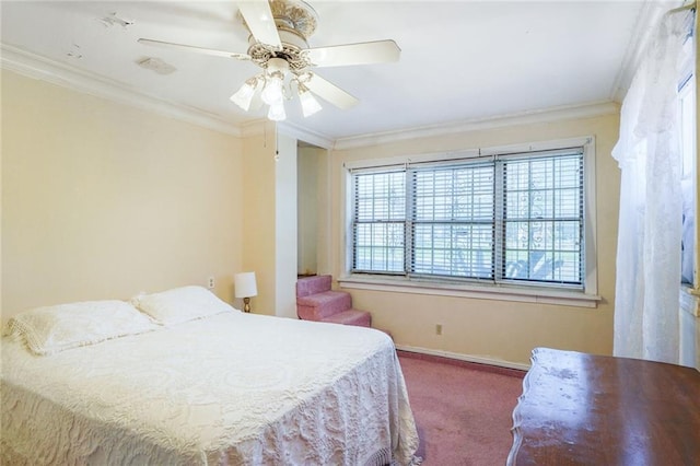 carpeted bedroom with a ceiling fan, ornamental molding, and baseboards
