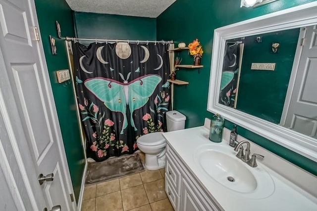full bath with tile patterned flooring, vanity, curtained shower, toilet, and a textured ceiling