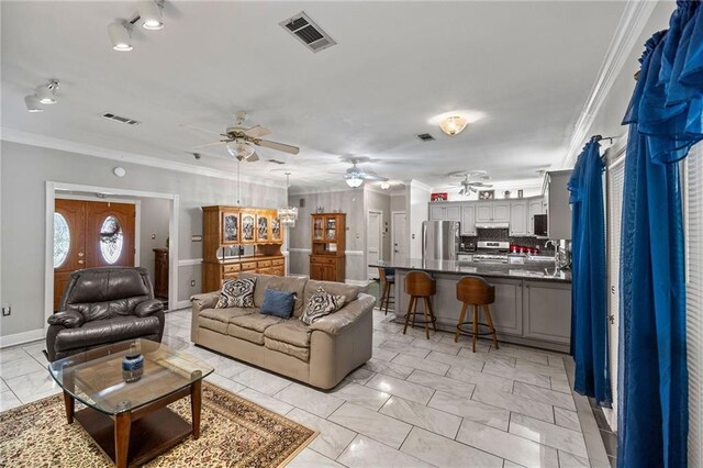41226 Rene Dr, Hammond, LA 70403 - living room with a ceiling fan, light marble finish flooring, and ornamental molding