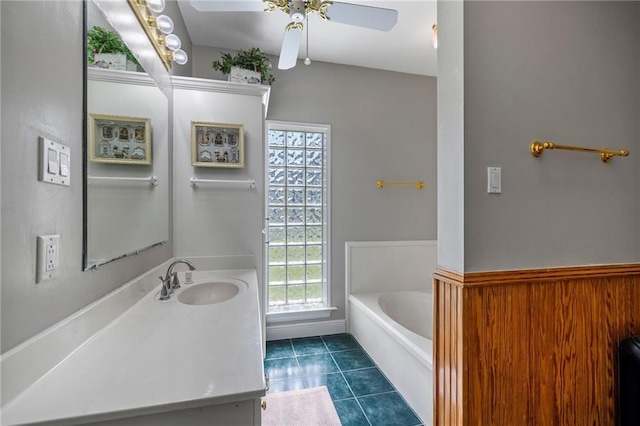 41226 Rene Dr, Hammond, LA 70403 - bathroom with vanity, a garden tub, tile patterned flooring, and a ceiling fan