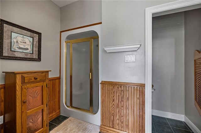 41226 Rene Dr, Hammond, LA 70403 - full bath with a wainscoted wall, tile patterned flooring, and a shower stall