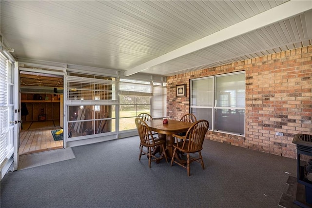 41226 Rene Dr, Hammond, LA 70403 - sunroom / solarium featuring a wood stove and outdoor dining space