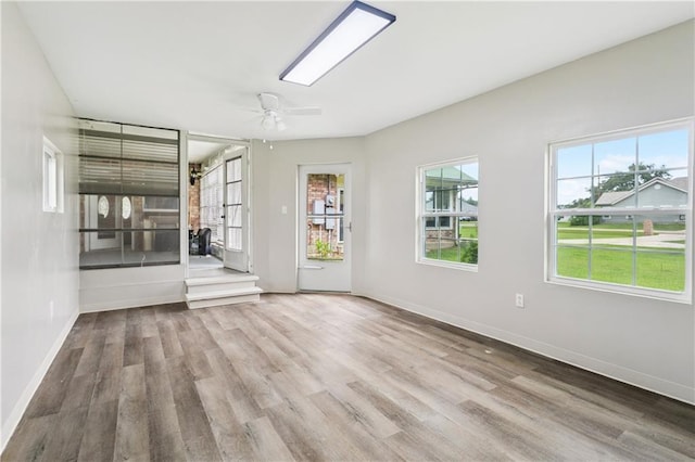 41226 Rene Dr, Hammond, LA 70403 - empty room with wood finished floors, healthy amount of natural light, and a ceiling fan