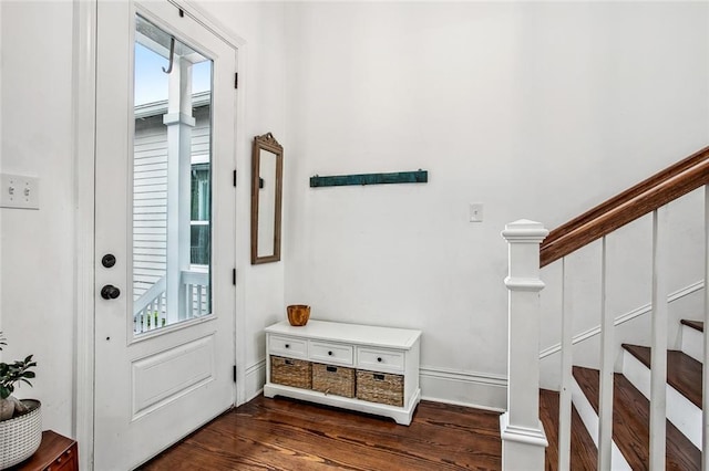 8501 Cohn St, New Orleans, LA 70118 - entryway featuring dark wood-type flooring, baseboards, stairway, and plenty of natural light