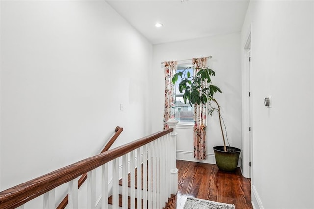 8501 Cohn St, New Orleans, LA 70118 - hall with recessed lighting, an upstairs landing, baseboards, and wood finished floors