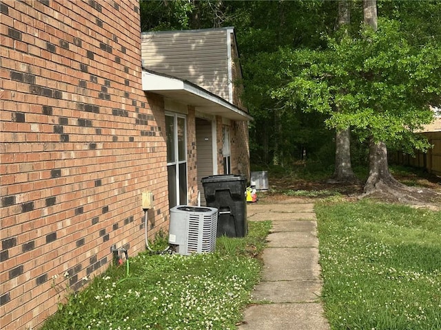 44154 Simpson Pl, Hammond, LA 70403 - view of home's exterior featuring brick siding and cooling unit