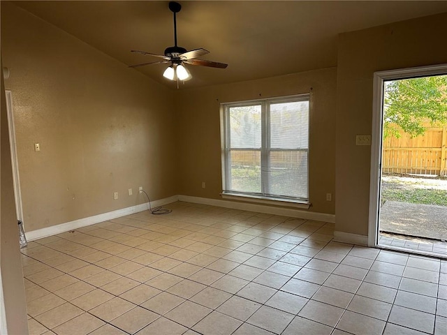 44154 Simpson Pl, Hammond, LA 70403 - unfurnished room with a ceiling fan, baseboards, vaulted ceiling, and light tile patterned floors
