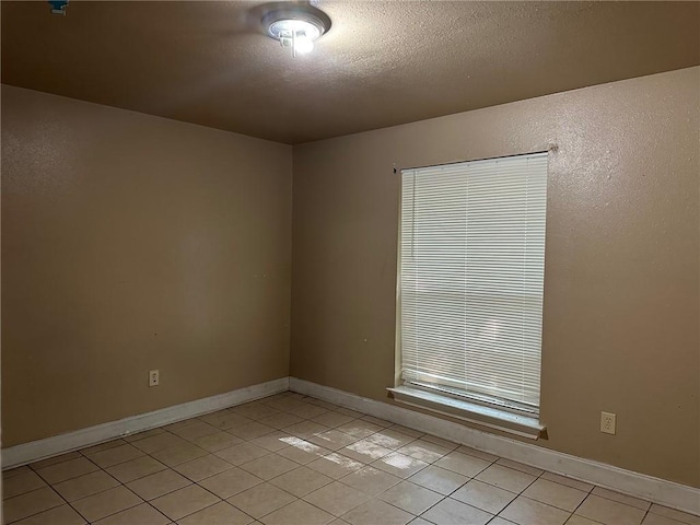 44154 Simpson Pl, Hammond, LA 70403 - unfurnished room featuring a textured ceiling, baseboards, and light tile patterned floors