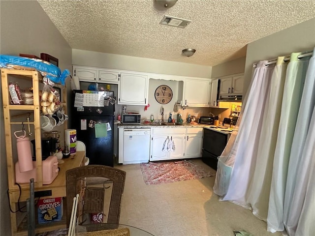 44176 Simpson Pl, Hammond, LA 70403 - kitchen featuring visible vents, under cabinet range hood, white appliances, and white cabinets
