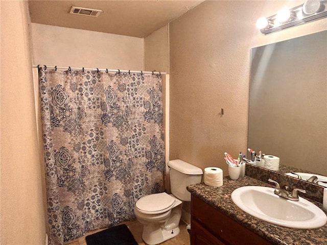 44176 Simpson Pl, Hammond, LA 70403 - full bathroom with visible vents, toilet, vanity, and a shower with curtain