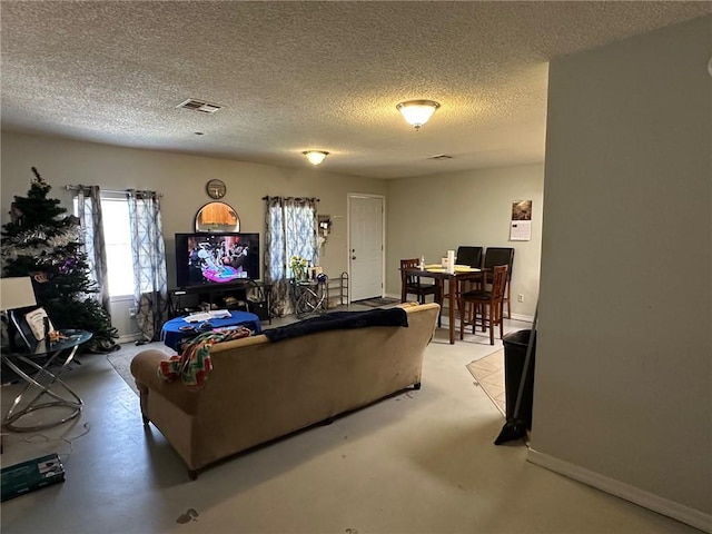 44301 Simpson Pl, Hammond, LA 70403 - living area featuring a textured ceiling, visible vents, and baseboards