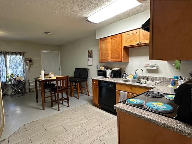 44301 Simpson Pl, Hammond, LA 70403 - kitchen featuring brown cabinets, visible vents, a sink, black appliances, and a textured ceiling