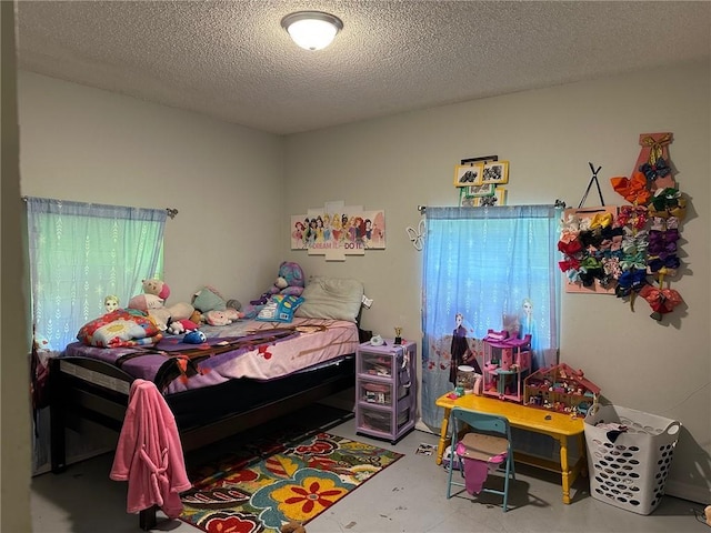 44301 Simpson Pl, Hammond, LA 70403 - bedroom with concrete flooring and a textured ceiling
