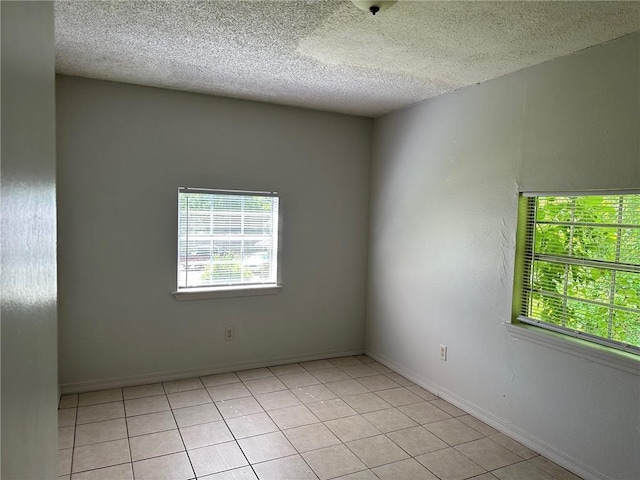 44321 Simpson Pl, Hammond, LA 70403 - spare room with plenty of natural light, a textured ceiling, and light tile patterned floors