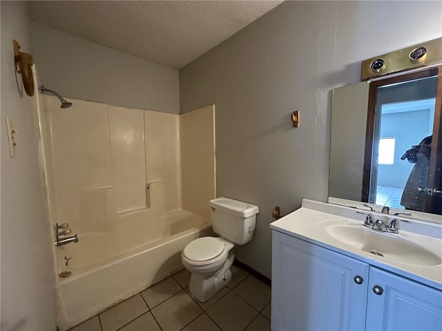 44321 Simpson Pl, Hammond, LA 70403 - bathroom with tile patterned floors, shower / bath combination, toilet, vanity, and a textured ceiling
