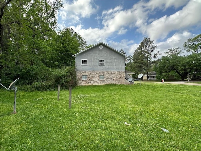 44321 Simpson Pl, Hammond, LA 70403 - view of home's exterior with a lawn and stone siding