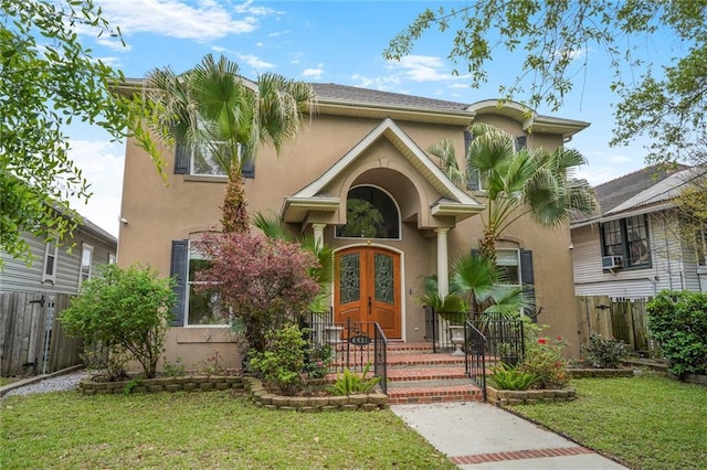 6021 W End Blvd, New Orleans, LA 70124 - mediterranean / spanish-style house featuring stucco siding and a fenced front yard