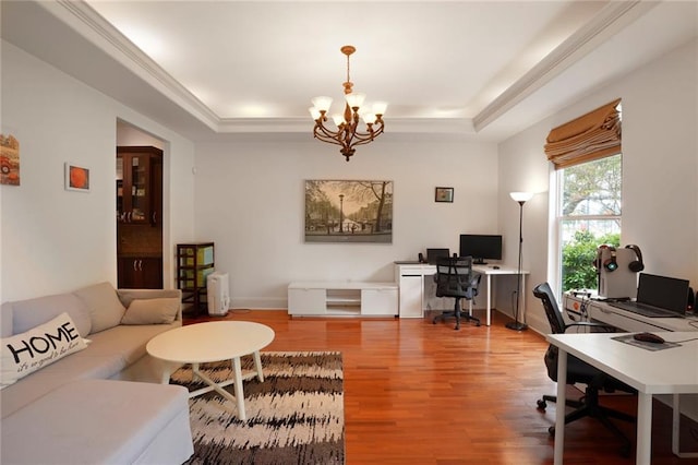 6021 W End Blvd, New Orleans, LA 70124 - living area featuring a tray ceiling, a desk, a chandelier, and light wood finished floors