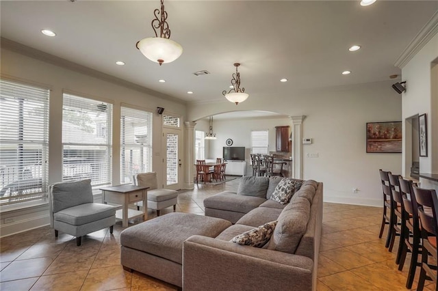 6021 W End Blvd, New Orleans, LA 70124 - living room with arched walkways, decorative columns, ornamental molding, recessed lighting, and light tile patterned flooring