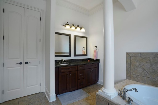 6021 W End Blvd, New Orleans, LA 70124 - bathroom featuring decorative columns, double vanity, a garden tub, crown molding, and tile patterned floors