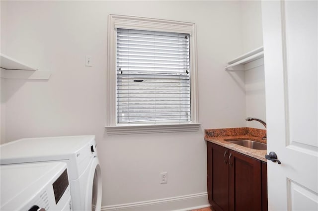 6021 W End Blvd, New Orleans, LA 70124 - laundry area featuring washing machine and dryer and cabinet space