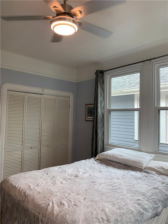 bedroom with a closet and ceiling fan