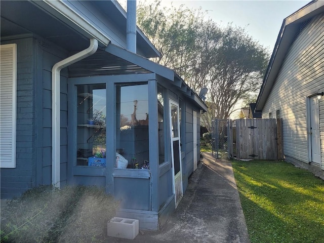 view of home's exterior featuring fence