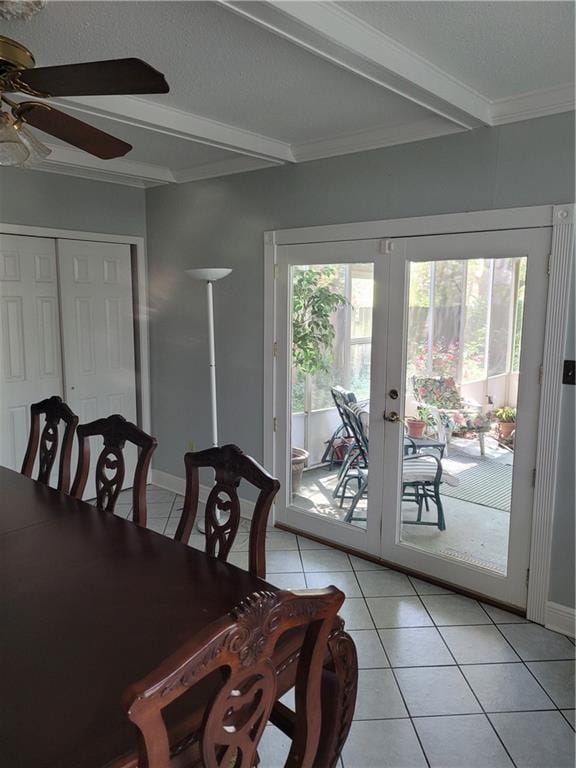 dining room featuring french doors, a ceiling fan, light tile patterned flooring, and beamed ceiling