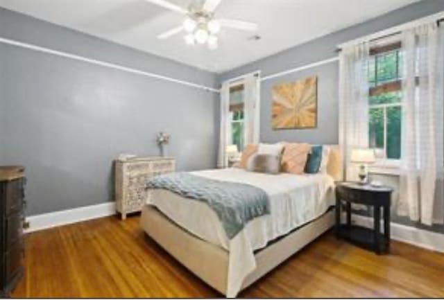 3015 Nashville Ave, New Orleans, LA 70125 - bedroom with wood finished floors, baseboards, and a ceiling fan