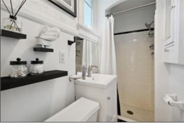 3015 Nashville Ave, New Orleans, LA 70125 - full bathroom featuring a shower stall and vanity