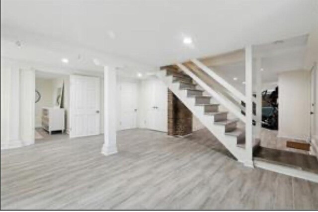 3015 Nashville Ave, New Orleans, LA 70125 - finished basement featuring wood finished floors, recessed lighting, and stairs
