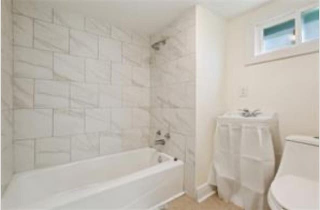 3015 Nashville Ave, New Orleans, LA 70125 - bathroom featuring toilet and bathtub / shower combination