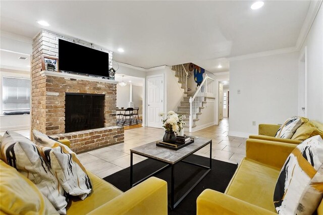 5601 Charlotte Dr, New Orleans, LA 70122 - living area featuring tile patterned flooring, stairway, recessed lighting, ornamental molding, and a brick fireplace
