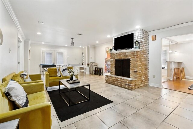 5601 Charlotte Dr, New Orleans, LA 70122 - tiled living area with baseboards, a fireplace, recessed lighting, and crown molding