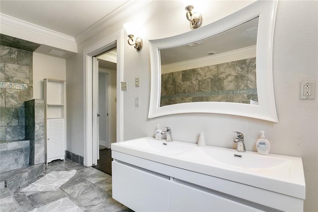 5601 Charlotte Dr, New Orleans, LA 70122 - full bathroom featuring crown molding, marble finish floor, double vanity, tiled shower, and a sink