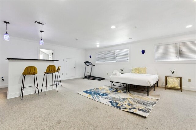 5601 Charlotte Dr, New Orleans, LA 70122 - living area with light carpet, baseboards, visible vents, and ornamental molding