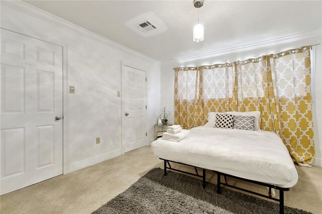 5601 Charlotte Dr, New Orleans, LA 70122 - carpeted bedroom with crown molding, baseboards, and visible vents