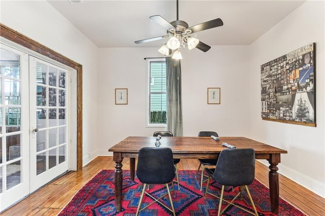 1524 N Dorgenois St, New Orleans, LA 70119 - dining room with hardwood / wood-style floors, baseboards, a ceiling fan, and french doors