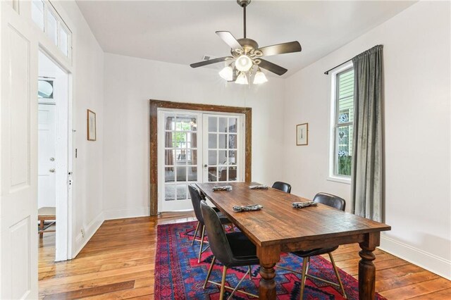 1524 N Dorgenois St, New Orleans, LA 70119 - dining area featuring light wood finished floors, plenty of natural light, and baseboards