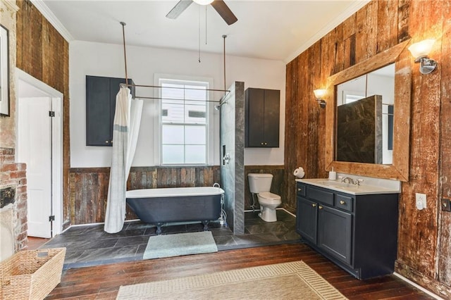 1524 N Dorgenois St, New Orleans, LA 70119 - full bath with toilet, ceiling fan, a freestanding tub, hardwood / wood-style floors, and vanity
