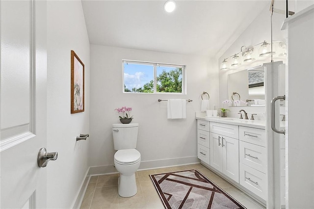 400 Fonda St, Paradis, LA 70080 - bathroom with toilet, baseboards, vanity, and vaulted ceiling