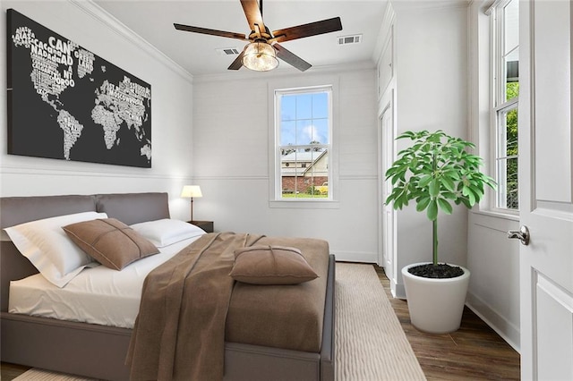 400 Fonda St, Paradis, LA 70080 - bedroom with multiple windows, visible vents, wood finished floors, and crown molding