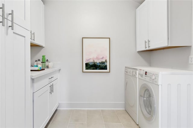 400 Fonda St, Paradis, LA 70080 - washroom featuring washer and dryer, cabinet space, baseboards, and light tile patterned floors